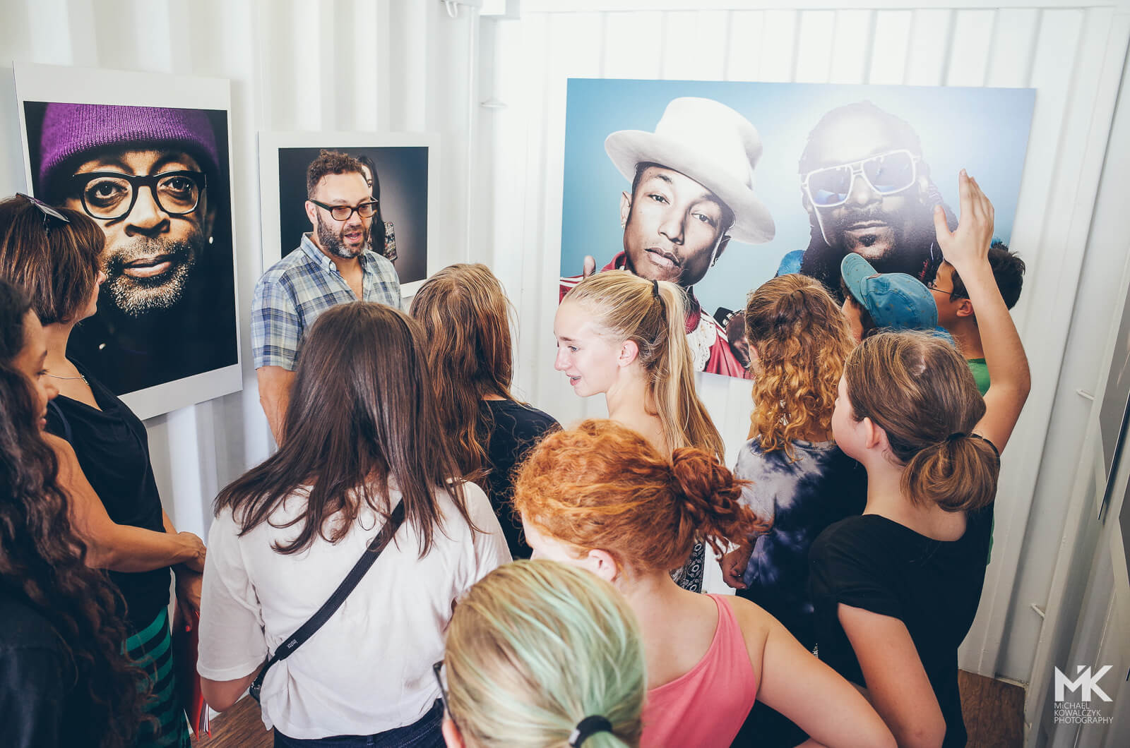 Curious students question Photographer Mark Mann about the celebrities behind the Luminaries portraits in Photoville 2015