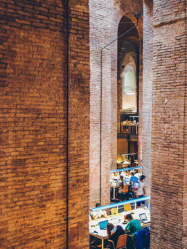 Barcelona Street Photography, high brick walls, les aigues library, students working, water reservoir