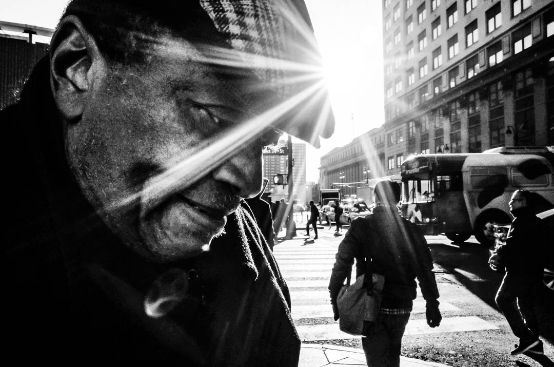 Sunflare in the face Black and White Street Photography NYC Michael Kowalczyk